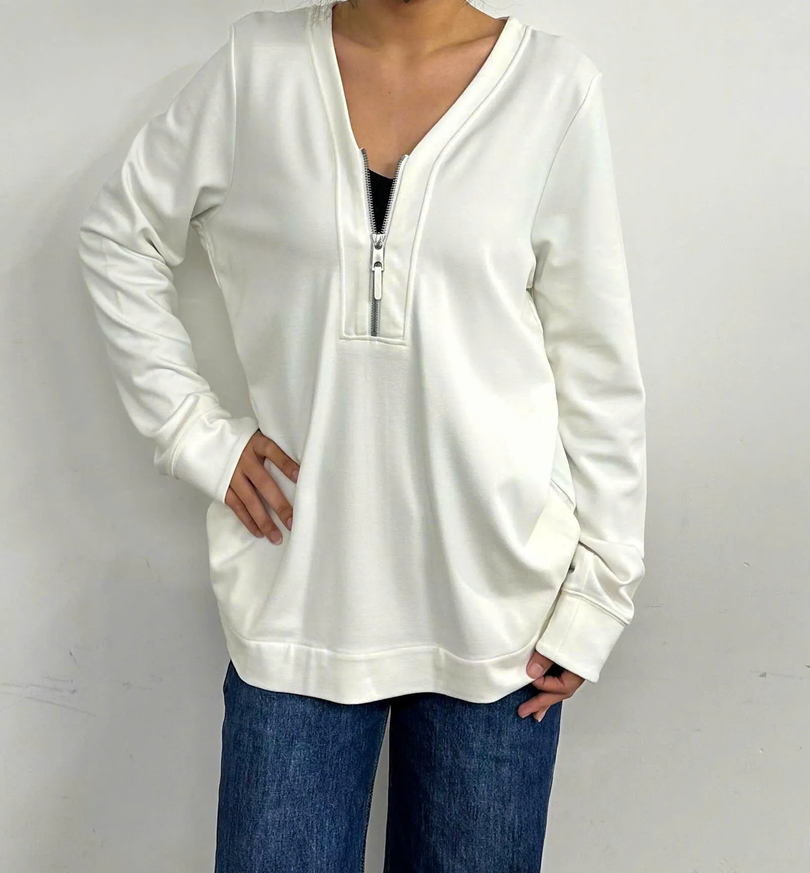 A woman wearing white Ponte Roma fashion made in Vietnam
